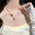 Colorful handmade beaded necklace with blue and white bird pendant worn by a model - 28# Multi-color Beaded Bird Pendant Necklace
