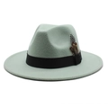 Detailed shot of mint green fedora hat featuring a black ribbon and leopard print feather - Mint Green