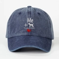 Detail of embroidered Me dog heart design on a washed denim baseball cap in dark blue - One Size / Navy Blue