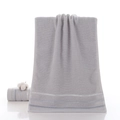 Thick light grey cotton towel with white herringbone weave border on white background - Fortune Chain Grey