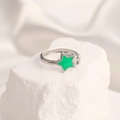Macro detail of adjustable silver ring featuring a vibrant green enamel star charm - Adjustable Open / Steel Color Star Green