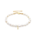 Macro shot of freshwater baroque pearl bracelet with gold letter K zircon pendant - Letter K