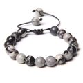 Detailed view of handmade woven tiger eye stone bracelet with adjustable black wax cord - Red Network Stone