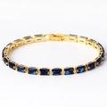 Vintage style gold bracelet with rectangular blue zircon stones and fold-over clasp - Blue Zircon Gold
