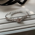 Elegant silver chain bracelet with oval cubic zirconia pave on a gray jewelry display - Anchor Link Bracelet (RF589) / Silver