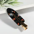 Pinza para el pelo de Halloween con murciélagos naranjas y calabazas sobre fondo negro - Calabaza Telaraña