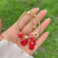 Handheld 18K gold plated snake chain bracelet with red Fatima hand and evil eye charms - Red