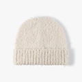 Thick cream white fuzzy knit beanie for women featuring a warm plush texture and folded cuff - Beige