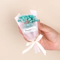 Close-up of mini dried baby's breath bouquet with Eternal Love tag and beige ribbon - Style 11 Blue Gypsophila Bouquet