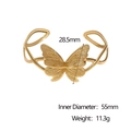 Brazalete abierto de acero inoxidable con diseño de mariposa en oro de 18k - Dorado