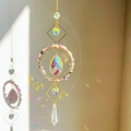 Detailed view of rainbow light reflections on wall from a crystal suncatcher pendant - Fluorite