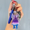 Space cat astronaut keychain with gradient purple-blue pixel bear and blue woven strap - Block Bear-Purple