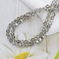Faceted 6mm grey crystal glass beads for jewelry making on a floral display - 6mm (approx. 100pcs) / Smoke Gray