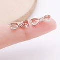 Silver copper jewelry pinch bail for pendants held on a fingertip to show small size - 6x15mm / White K/Silver