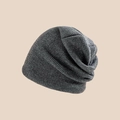 Close-up of dark grey ribbed knit beanie showing thick texture and warm woolen fabric - Deep Heather Grey