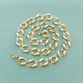 Macro view of gold metal and clear acrylic chain links with secure lobster clasps - Transparent & Gold