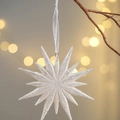 Sparkly silver star Christmas ornament with glitter finish and ribbon on bokeh background - Crystal Pendant Ice