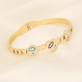 Golden stainless steel snake bracelet with evil eye charms on beige silk background - Round & Heart Evil Eye Charms Style (9#)