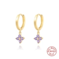 Macro detail of S925 sterling silver hoop earrings with purple zircon flower pendants - Gold with Purple Zirconia