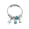 Silver stainless steel twisted bangle with blue sea star and swan crystal charms - Swan Starfish Shell (C2-002) / Blue