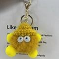 Cute yellow plush coal ball keychain with a matching knit hat and gold clasp - Yellow