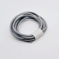Macro view of grey PU leather piping cord with detailed stitching for bag accessories - Gray