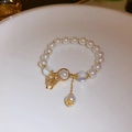 Elegant white pearl bracelet with gold butterfly charm and clear frosted bead accents - 95# Elastic Bracelet-White Pearl-Gold Butterfly