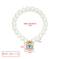 Detail view of evil eye pearl bracelet with measurements 174mm perimeter and 8mm beads - Evil Eye (LE19GD01)