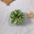 Single green satin scrunchie with silk gloss finish and elegant ruffled design - Grass Green