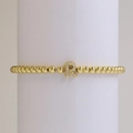18k gold plated brass beaded elastic bracelet featuring a micro-pave letter R charm - Letter R