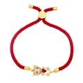 Cute red woven rope bracelet featuring a gold bear charm with sparkling heart stone - Red