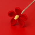 Detail of hand-crocheted red violet flower with yellow stamen and light green stem - Red