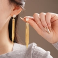 Close-up of sparkling cubic zirconia square studs and long gold tassel chains on ear - Square Zircon Fine Chain Long Tassel Style (23# Silver Earring Post - Gold)