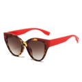 Fashionable oversized cat-eye sunglasses with tortoise frame and red temples in side view - Tortoiseshell Red Frame Tea Lens