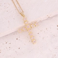 Macro detail of 18K gold-plated cross pendant with sparkling micro-pave pink cubic zirconia - 5# Pink