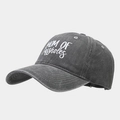 Close-up of washed cotton texture and white embroidered text on dark grey baseball cap - Adjustable / Washed Grey