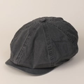 Detail view of washed dark grey cotton newsboy cap showing seams and fabric texture - Gray
