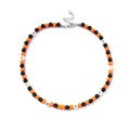 Beaded necklace with black, orange, and white heart patterns and silver clasp - Yellow and Black Heart