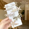 Set di 7 eleganti fermagli per capelli con perle e fiocchi di strass oro e bianco - 4# Set da 7 Pezzi Fiocco con Strass