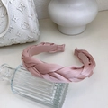 Pink satin braided headband with twist design shown on a glass vase accessory - Purple Pink