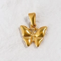 Macro shot of 24K gold plated butterfly pendant charm with polished finish on white texture - Dark Opal Butterfly Necklace / Gold