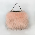 Chic pink faux fur handbag with black leather handles and gold-tone metal hardware - Pink