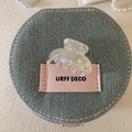 Detail shot of clear acetate hair claw clip with rhinestones on a denim accessory bag - Mermaid Color