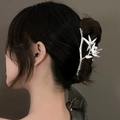 Detailed close-up of a silver bamboo-shaped hair claw with an elegant white pearl - Silver Emerald Bamboo Claw Clip