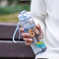 Cute Capybara cartoon water bottle with light blue lid and portable carrying strap - Transparent Blue