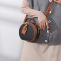 Genuine leather round crossbody bag featuring black and brown color-blocking with pebble grain - 17X15X8 / Black
