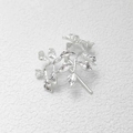Close-up of silver metal leaf hair hook with fine texture on white textured background - Sand Silver