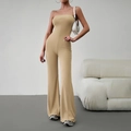 Elegant khaki strapless jumpsuit with slim fit and flared legs on a model - S / Khaki