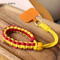 Adjustable hand-woven phone wrist strap in vibrant red and yellow paracord with orange tab - Short [Yellow & Red] Adjustable Braided Lanyard + Yellow Patch