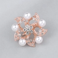 Rose gold flower brooch with white pearls and sparkling crystals in a hollow floral design - Rose Gold Five-Petal Hollow Floral Brooch (XD8510-2)